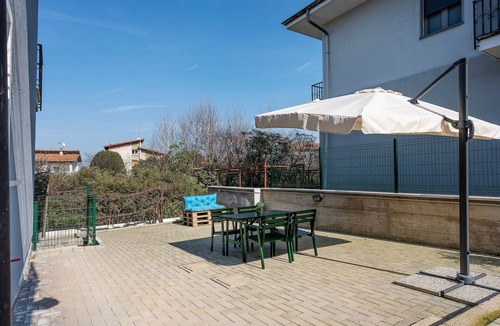 Arona Apartment | Apartment 'Bambù' with Private Garden, Balcony and Wi-Fi