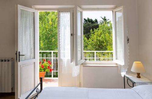 Riparbella Apartment | Apartment 'L'arancio' with Sea View, Private Terrace and Wi-Fi