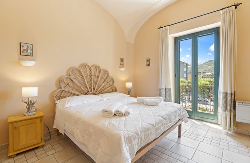 Bosa Historic Centre Apartment | Apartment 'Le Residenze In Piazza' with Balcony, Wi-Fi and Air Conditioning
