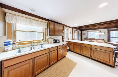 Bayville Cabin | Appalachee Pond Waterfront Cottage | Decks, Sunroom, Dock with Kayaks & Canoe