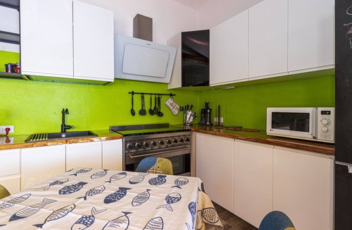 Seccheto Apartment | Camilla, a three-room apartment in Seccheto with a splendid sea view, a small balcony equipped with