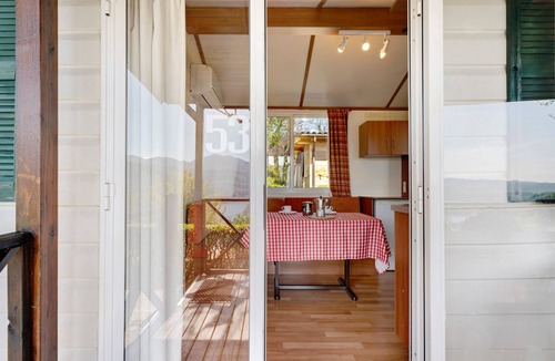 Pratolungo RV Rental | Caravan 'Mobile Home Comfort Vista Lago' with Lake View, Shared Pool and Private Garden