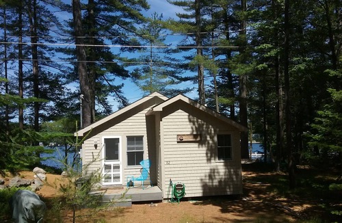 Milton Cottage | Charming lakefront cottage with sandy beach on a large private wooded lot
