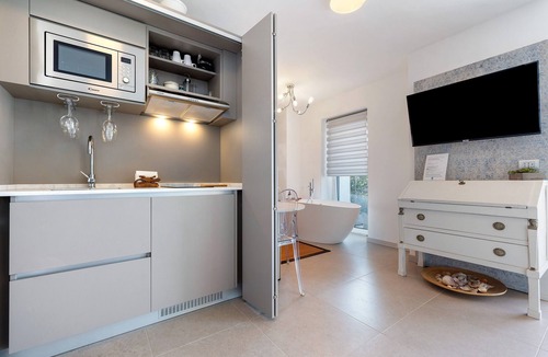 Ville del Monte Apartment | Eco del Garda - Deluxe Studio 101 with Covered Terrace and Lake View