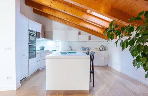 Cesana Brianza Apartment | GuestHost - Travel with your family and friends and explore lakes and mountains near Como!This large attic, with two bedrooms, two bathrooms, open space kitchen with island, large living room, terraces and patio for relaxing, is located on the road that