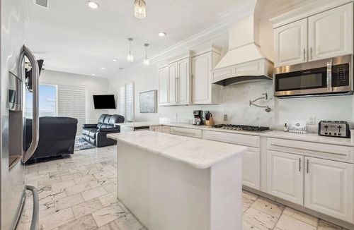 Delos House | Gulf Front Home with Private Pool, In-Home Elevator and Movie Theatre