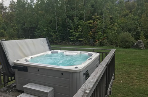 Carrabassett Valley Condo | High End 3 bed 3 bath ski in/out condo with private hot tub on the back deck!
