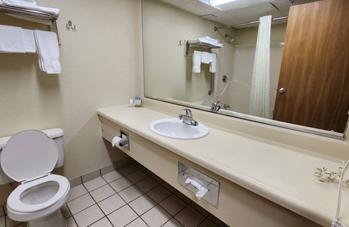 Sherman Station Apartment | King hotel suite with living room, large fridge/freezer in Millinocket, Maine