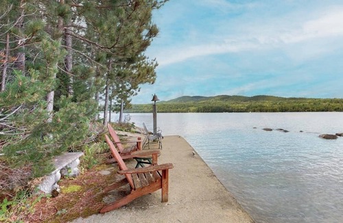 Greenville Junction House | Lakefront Home with Private Dock, Pebble Beach & Enclosed Porch - Dogs Welcome