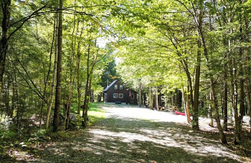 Lincoln Cabin | Quaint 1 Bedroom + Loft/1 Bath streamside Timber Frame cabin near Lincoln, ME.