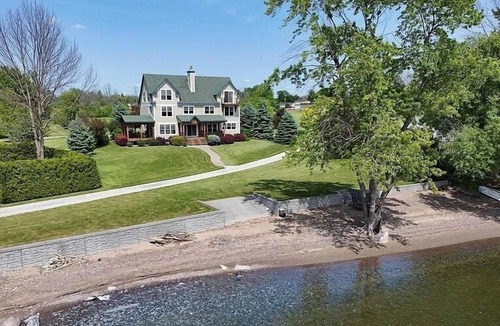 Alburg House | Stunning lakefront estate-sandy beach-family friendly-private dock-large lawn