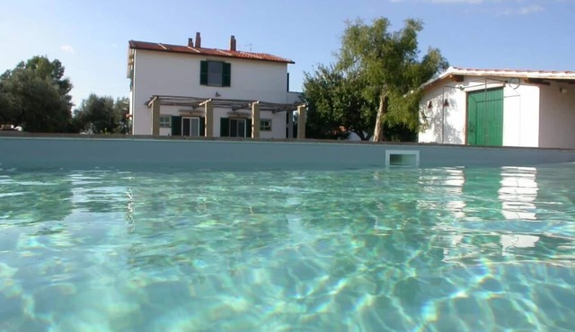 A farm house, situated on a hillock of the Maremma in the Latium