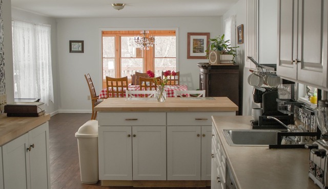 Comfy family-friendly log-sided home with lake frontage and dock