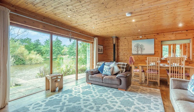 Ground floor: Spacious open plan lounge, kitchen, dining area with log burner.
