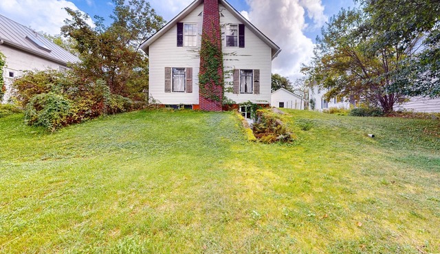 Historic, two-story 1860s home with a large yard, washer, & fireplace