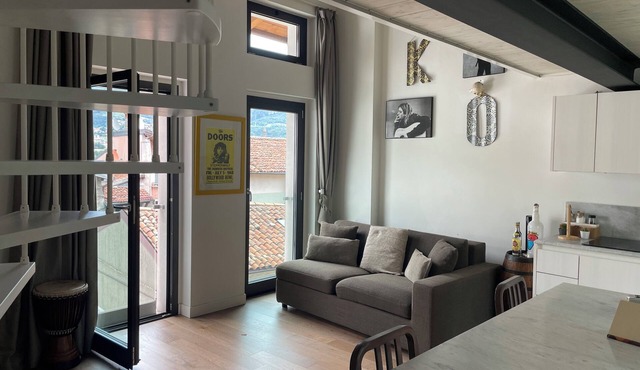 Open-plan loft overlooking Lake Como with private parking space