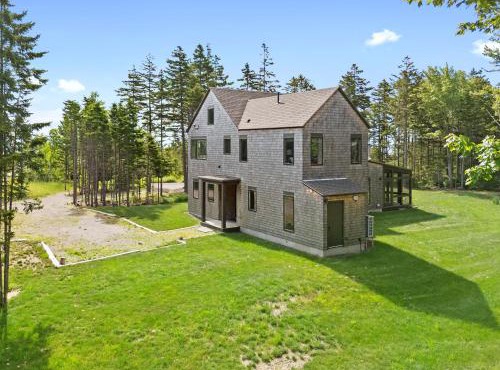 Quiet, modern, dog-friendly home with ocean views, private trails & firepit