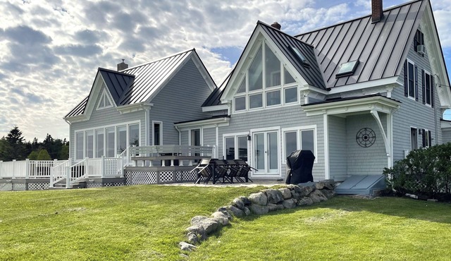 Quintessential waterfront home with over 400 feet of private sandy beach.
