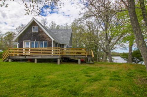 Remodeled Waterfront Home with Wraparound Deck, Water Views, & Beach Access