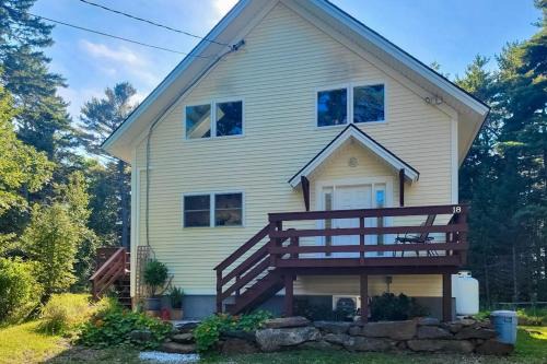 Sunny coastal retreat with deck, grill, beach, dock, & ocean access